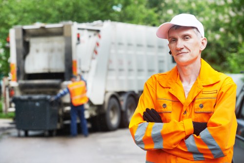 Electric waste collection van parked outside a commercial property