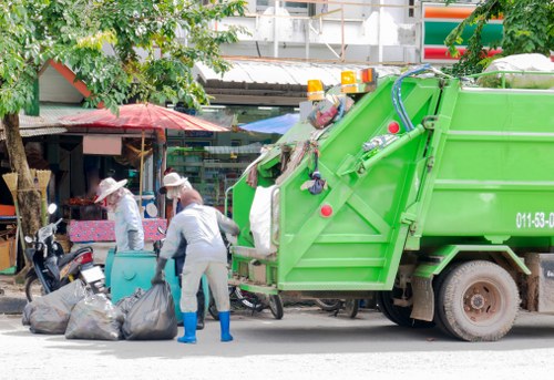 Business professionals discussing waste removal services in Brimsdown.
