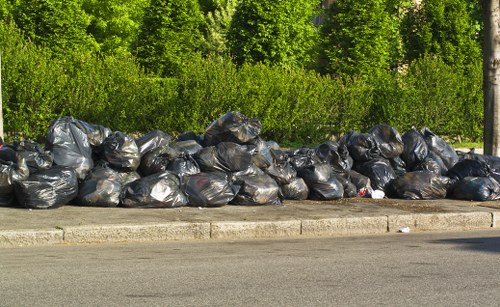 Workers safely removing construction waste from a Brimsdown site